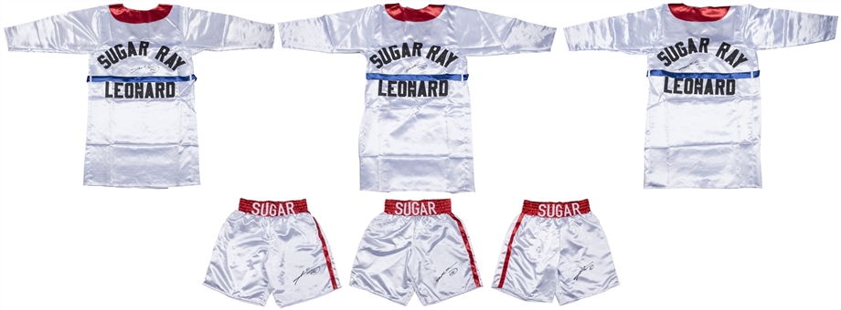Lot of (6) Sugar Ray Leonard Signed Robes and Trunks (3 of Each) (PSA/DNA) 